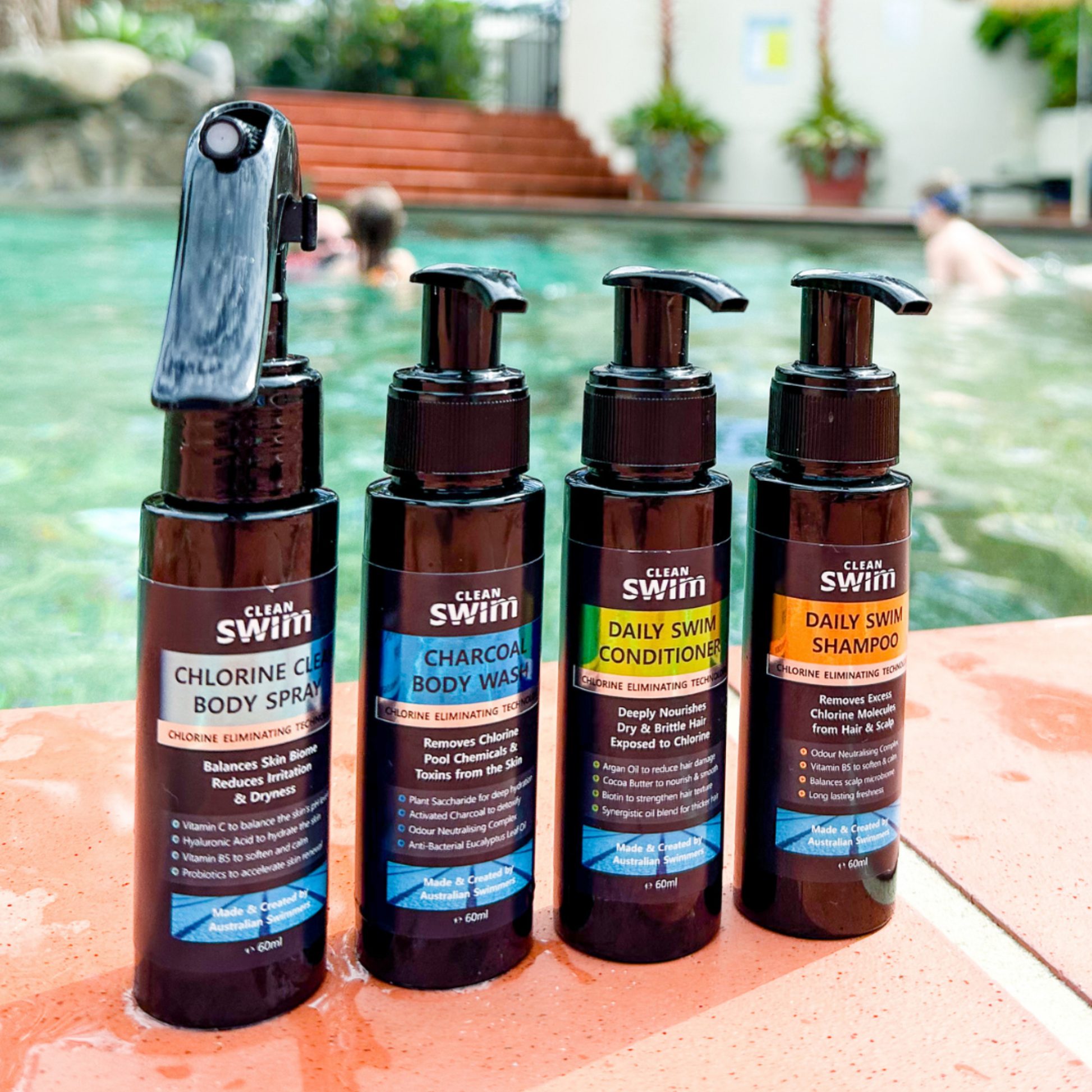 Clean Swim On-The-Go Travel 4-Pack in a convenient carry bag, featuring travel-sized Daily Swim Shampoo, Conditioner, Charcoal Body Wash, and Chlorine Clear Body Spray.